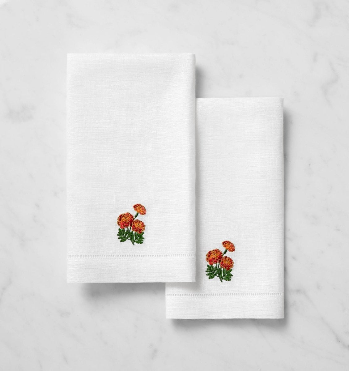 SFERRA Linens FIORENZA BIRTHFLOWER GUEST TOWEL OCTOBER MARIGOLD COMP at Fig Linens and Home