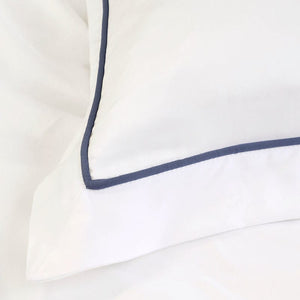 Detail of Blue Stitching on Pom Pom at Home Sheena Navy Blue Bedding | Bamboo Sheets and Duvet Cover