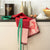 lumière d'étoiles red apron | Christmas Apron by Le Jacquard Francais shown in kitchen after party