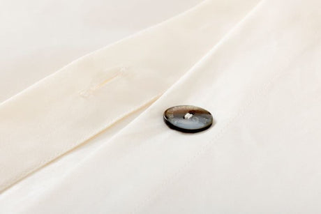 Duvet button Prodige Crème Bedding by Yves Delorme Couture at Fig Linens and Home