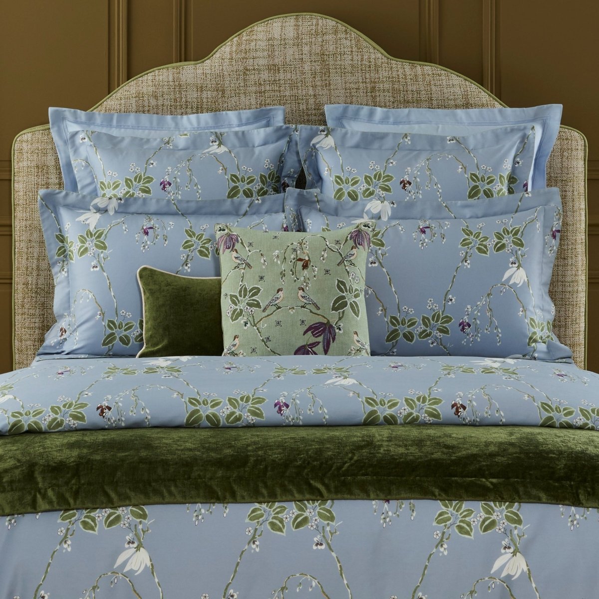 Rameau Amande Decorative Pillow by Yves Delorme shown on Bed