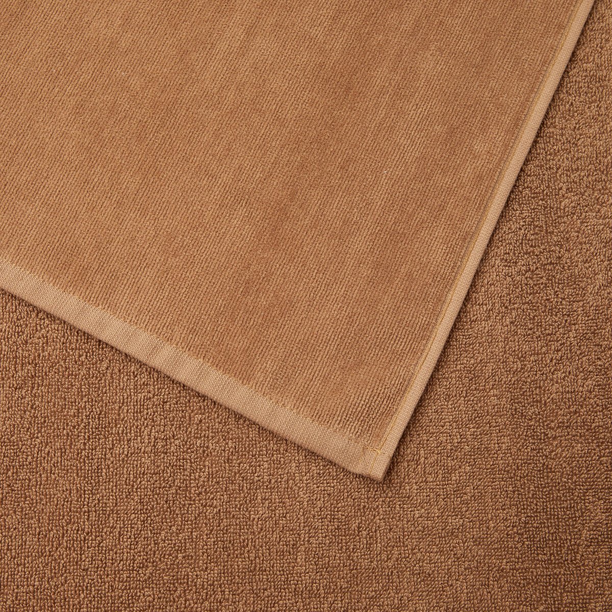 Zuma Sculpted Beach Towel by Hugo Boss Home | Yves Delorme Camel Pool Towel at Fig Linens and Home 4