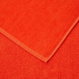 Zuma Sculpted Beach Towel by Hugo Boss Home | Yves Delorme Spice Pool Towel at Fig Linens and Home 4