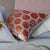 Designers Guild Manipur Coral Decorative Pillow Stacked with Floral Pillows