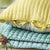Designers Guild Chenevard Sky & Cloud Quilt Shown with Yellow Accents