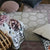 Manipur Natural Rug shown with Floral Pillows | Fig Linens