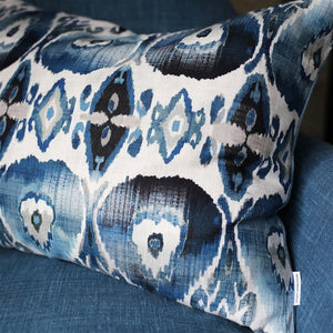 Cuzco Indigo Decorative Pillow shown on Blue Chair