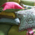 Designers Guild throw pillow - Brera Lino Cerise & Grass pillow shown with florals