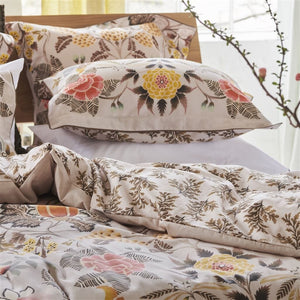 Designers Guild Bedding - Brocart Decoratif Sepia Duvet Covers and Shams stacked on a bed