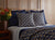 Linea Navy Blue Coverlet Set by Ann Gish - Shown with duvet cover and shams with white sheets