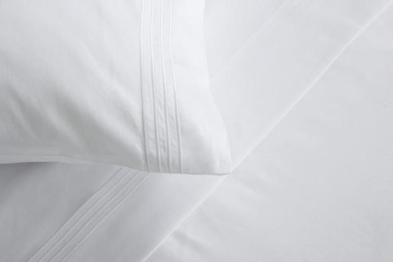 Frette Hotel Cruise White Detail of Stitching on Bed Linens | Fig Linens