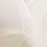 Frette Grace Bedding in Milk - Pillowcase and bed sheet Detail with Shadow Stitch shown