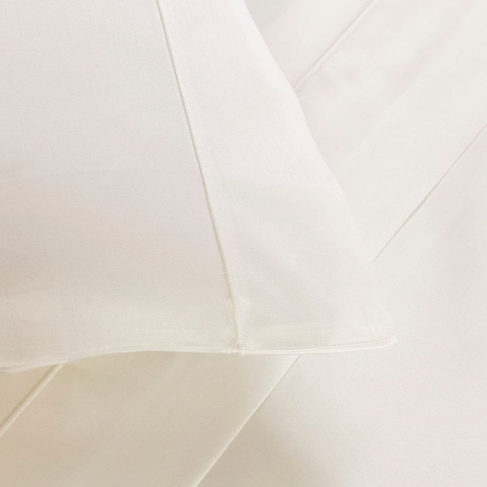 Frette Grace Bedding in Milk - Pillowcase and bed sheet Detail with Shadow Stitch shown