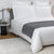 Frette Pure Cashmere Throw Blanket in Anthracite Shown as Bed End | Fig LInens and Home