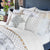 Divit Metallic Throw Pillow by John Robshaw - Lifestyle Image Bed - Fig Linens and Home