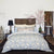 Bamana Sand Decorative Pillow shown on Blue and Sand Bed | John Robshaw at Fig Linens and Home