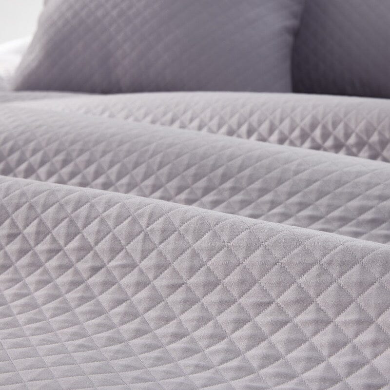 Matouk Petra Matelasse Coverlet Detail of Diamond shown in Deep Lilac | Fig Linens and Home Bedding