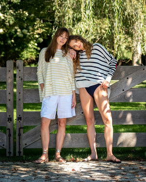 Mersea Catalina Sweater Limoncello Stripe shown on female model with friend wearing another color 2