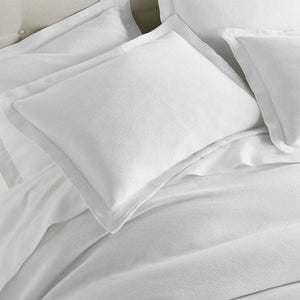Pillow Shams on Bed of Angie White Stonewashed Matelassé Coverlet | Peacock Alley