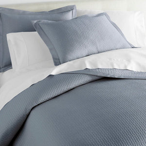 Peacock Alley Coverlets | Hamilton Blue Quilted Coverlet and Shams Close-up View on Bed with Sheets