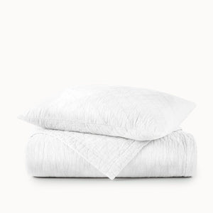 Peacock Alley Coverlet - Heritage White Stone Washed Linen Quilt folded with pillow on top