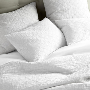 Peacock Alley Coverlet - Heritage Stone Washed Linen Quilt in White Shown on Bed with Shams