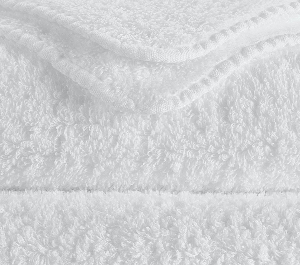 https://www.figlinensandhome.com/cdn/shop/products/fig-linens-abyss-habidecor-super-pile-bath-towels-white-closeup-100_1200x.jpg?v=1692055761