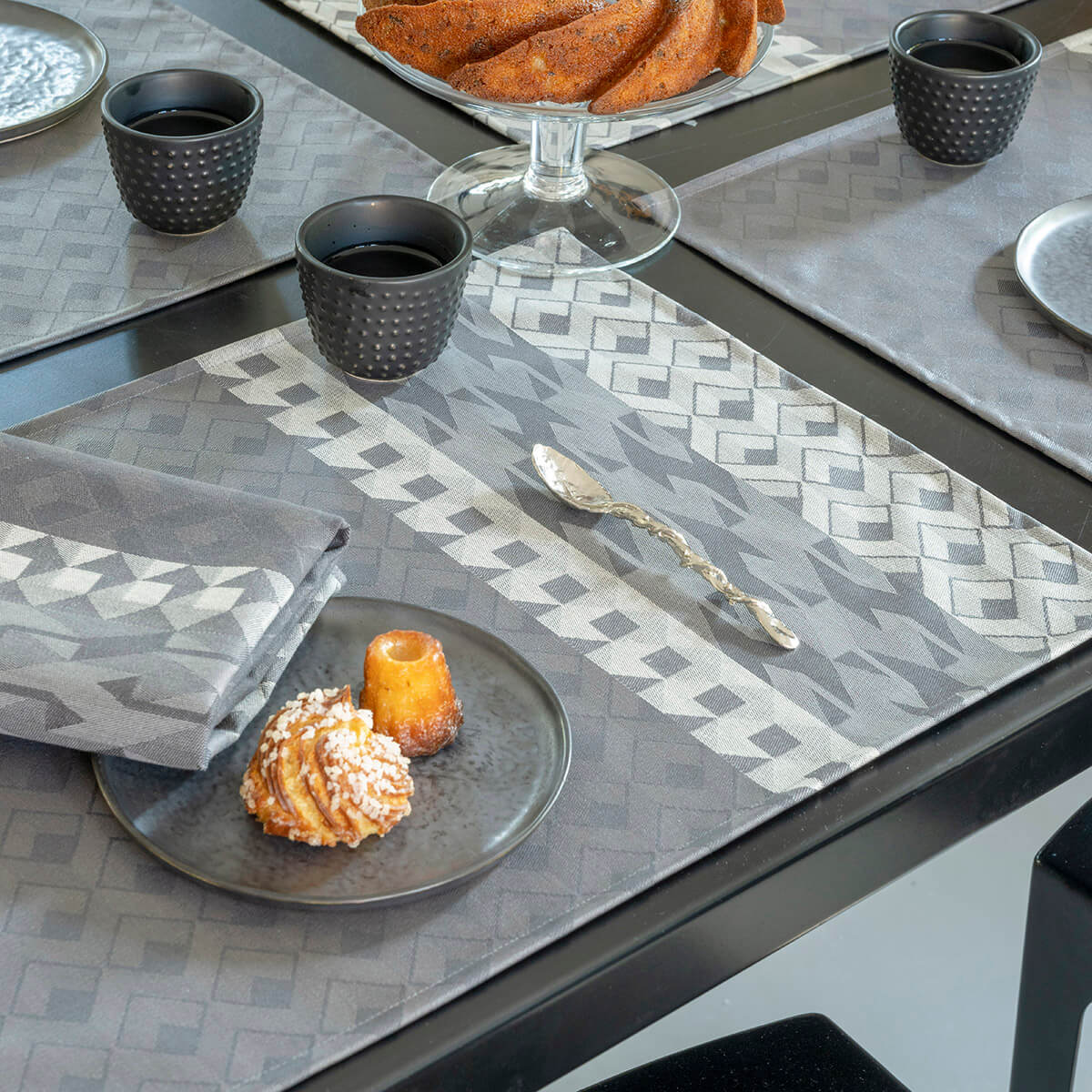 Caractere Coated Grey Table Linens, Napkins &amp; Placemats | Le Jacquard Français